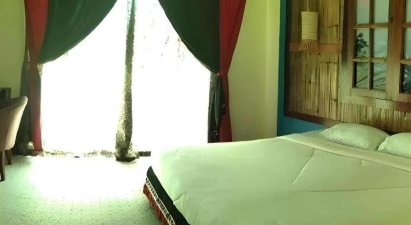 Bed in Phumanee Home Hotel