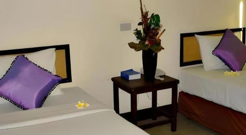 Bed in Phumanee Home Hotel