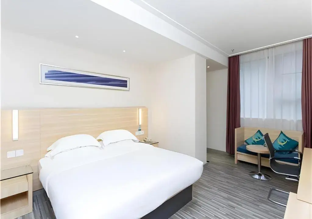 Bed in City Comfort Inn Jiangmen Xinhui Xiangshan Park Bed in City Comfort Inn Jiangmen Xinhui Xiangshan Park