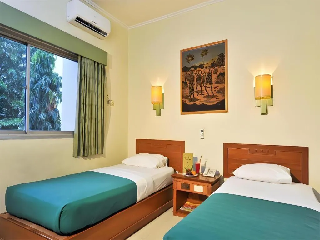 Bed in Muria Hotel
