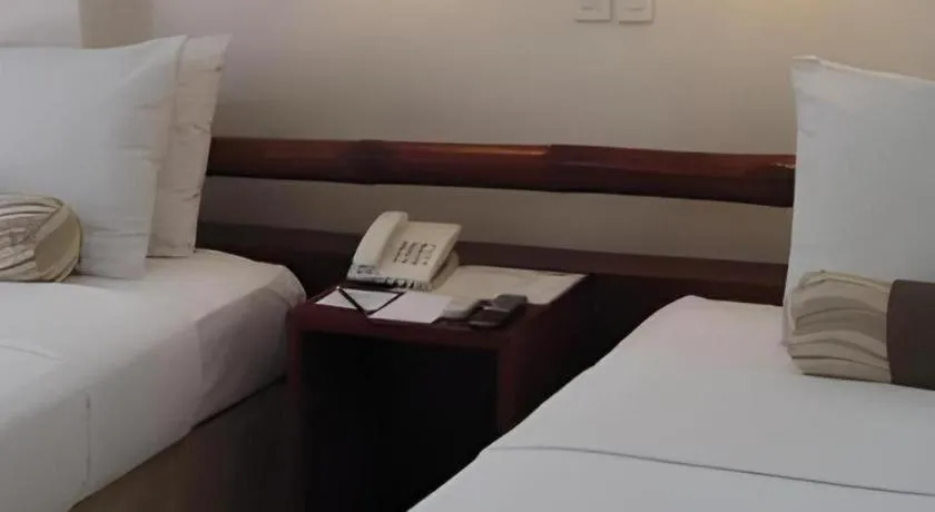 Bed in Soledad Suites