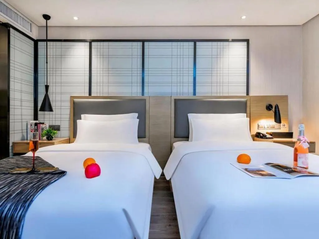 Bed in Echarm Hotel Guiyang International Convention & Exhibition Center