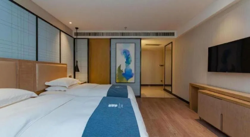 Bed in Echarm Hotel Guiyang International Convention & Exhibition Center