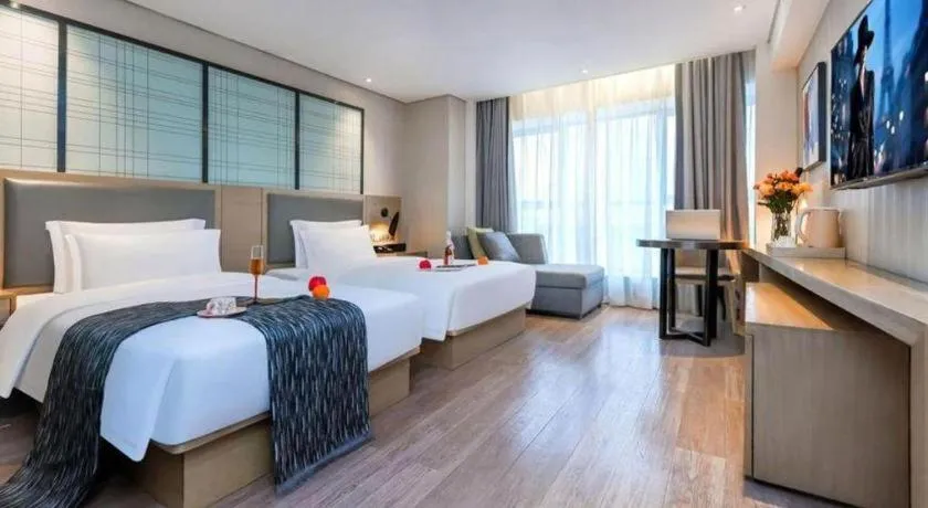 Bed in Echarm Hotel Guiyang International Convention & Exhibition Center