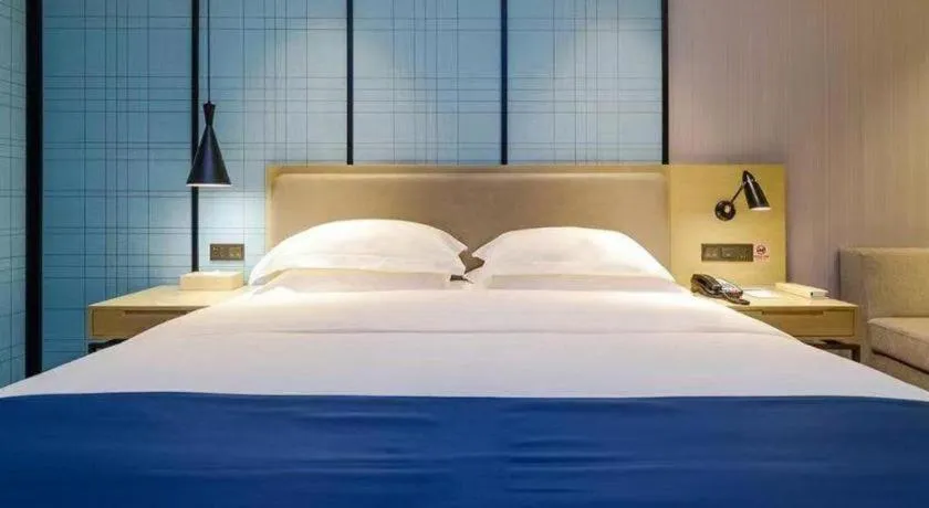 Bed in Echarm Hotel Guiyang International Convention & Exhibition Center