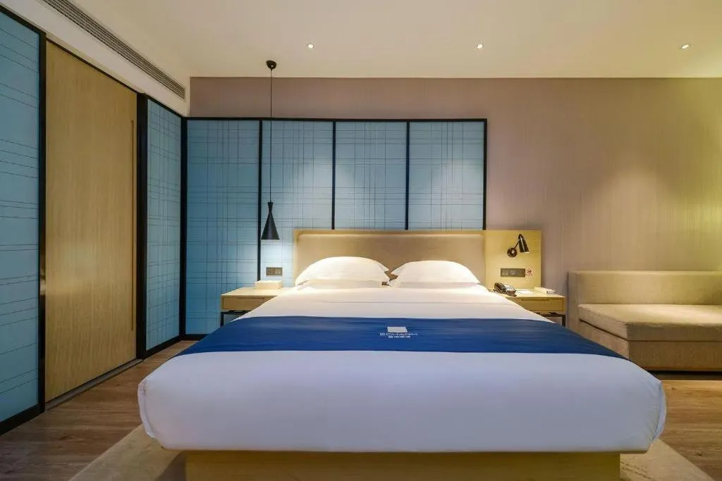 Bed in Echarm Hotel Guiyang International Convention & Exhibition Center