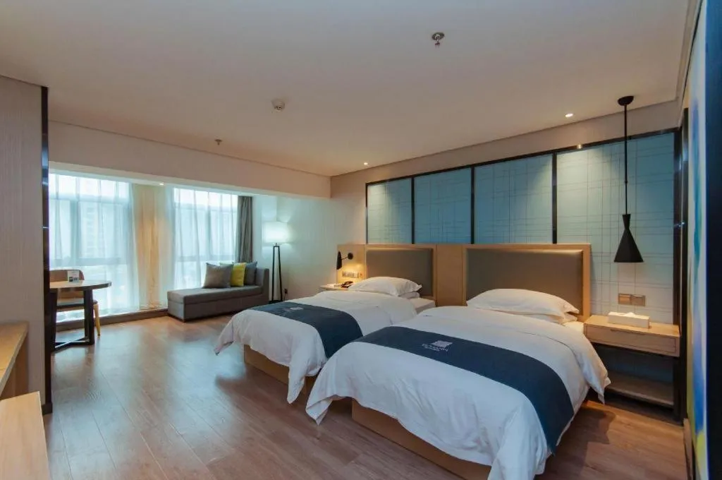 Bed in Echarm Hotel Guiyang International Convention & Exhibition Center