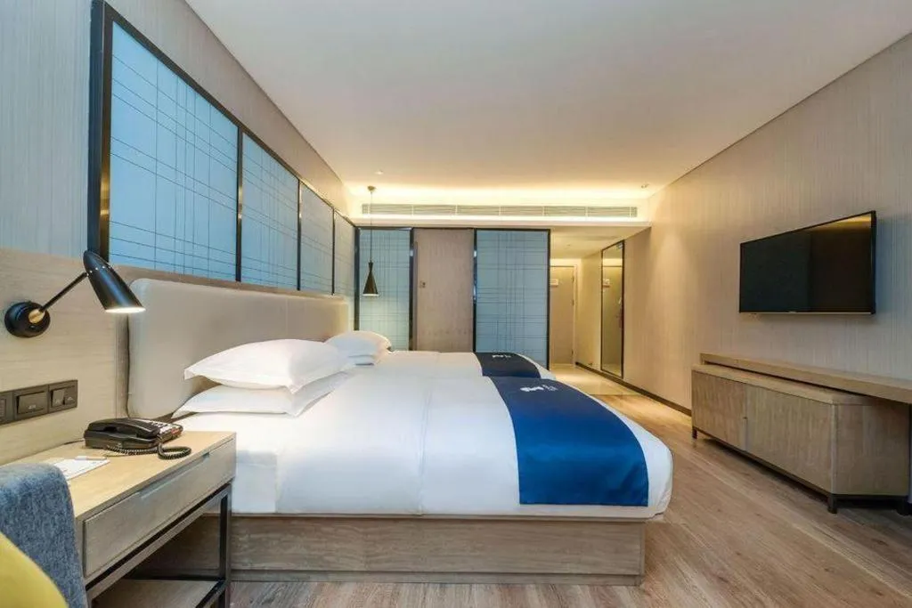 Bed in Echarm Hotel Guiyang International Convention & Exhibition Center