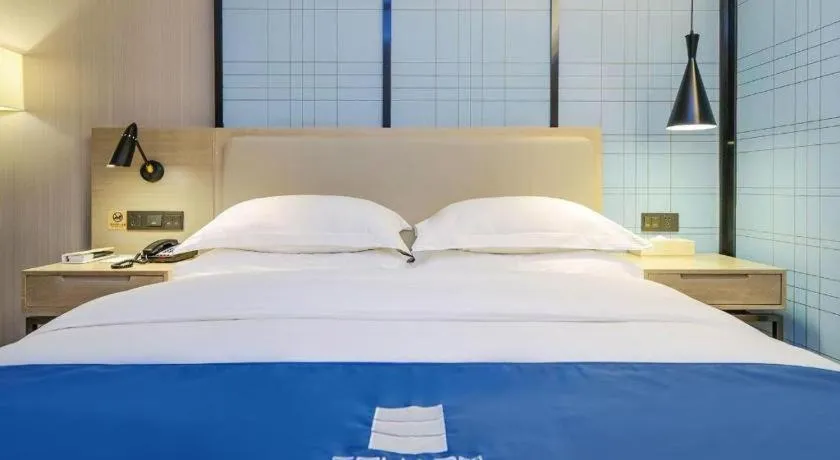 Bed in Echarm Hotel Guiyang International Convention & Exhibition Center