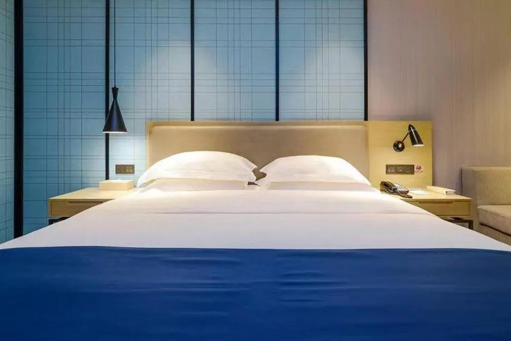 Bed in Echarm Hotel Guiyang International Convention & Exhibition Center