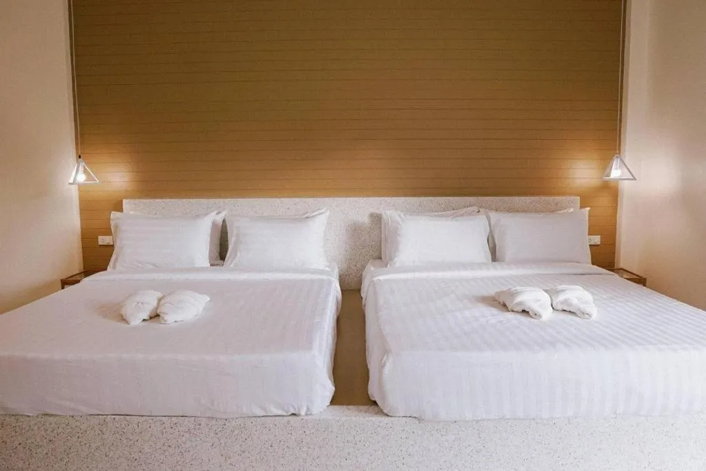 Bed in Nata Resort Chanthaburi II