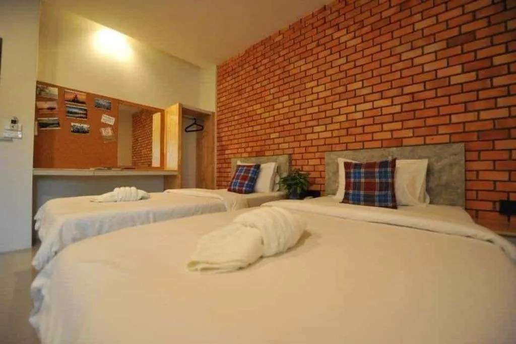 Bed in Nata Resort Chanthaburi II