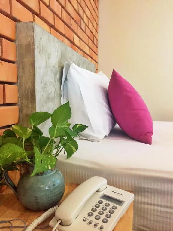 Bed in Nata Resort Chanthaburi II