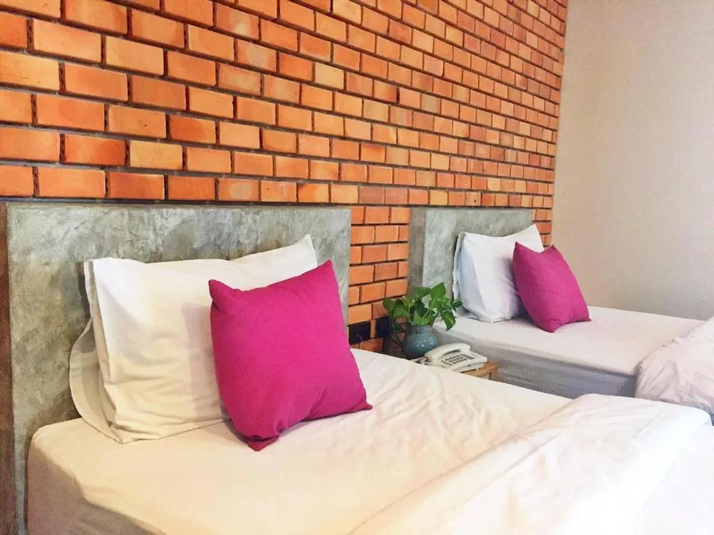 Bed in Nata Resort Chanthaburi II