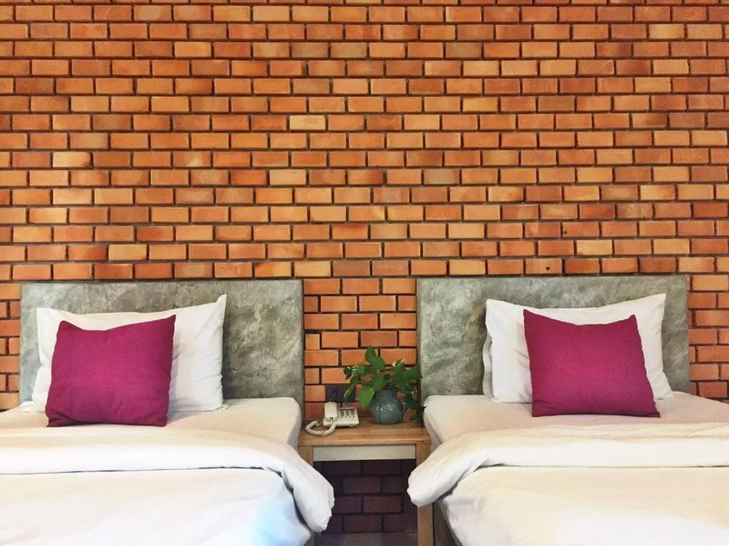 Bed in Nata Resort Chanthaburi II