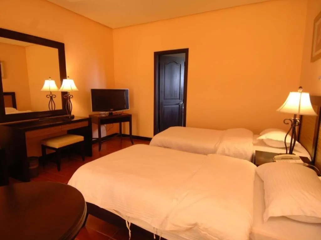 Bed in Planta Centro Bacolod Hotel & Residences