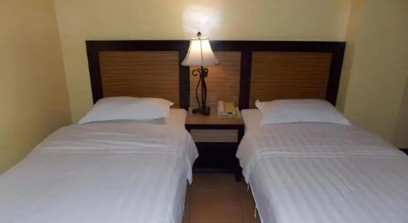 Bed in Planta Centro Bacolod Hotel & Residences Bed in Planta Centro Bacolod Hotel & Residences