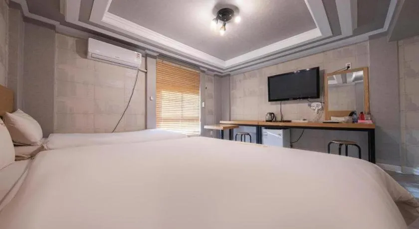 Bed in Gwangju Sejong Hotel