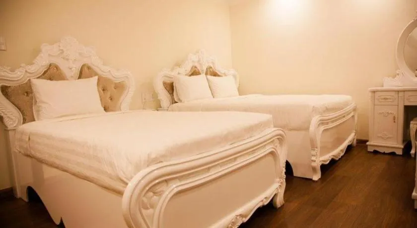 Bed in Hoa Sen Vang Hotel Dalat