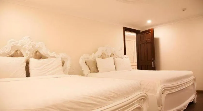 Bed in Hoa Sen Vang Hotel Dalat