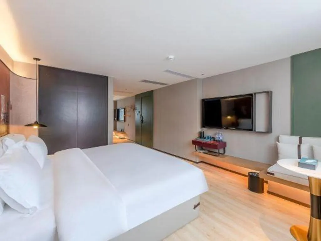 Bed in Bravo Business Hotel