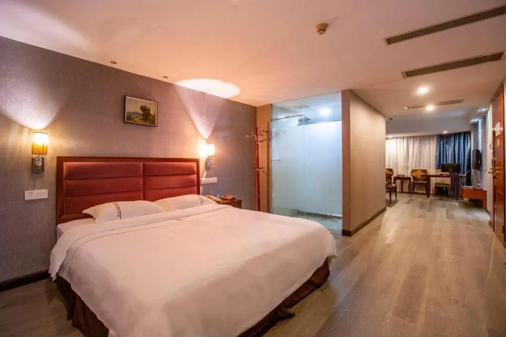 Bed in Bravo Business Hotel