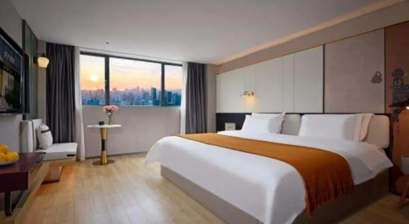 Bed in Bravo Business Hotel