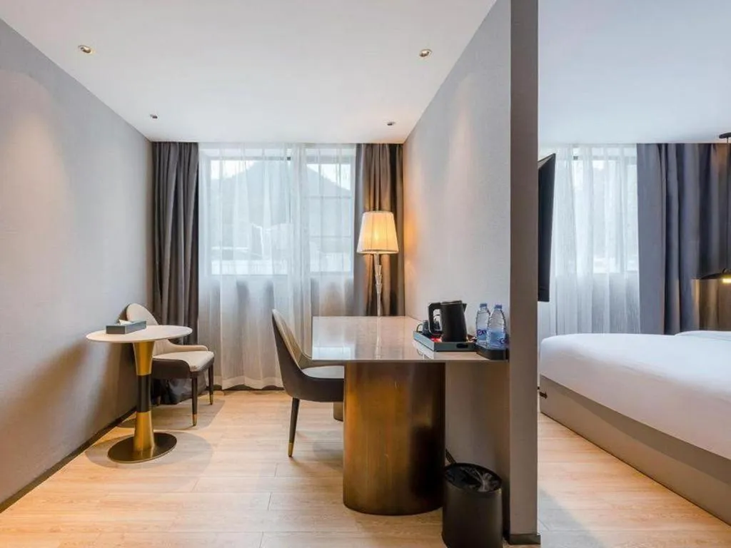 Bed in Bravo Business Hotel