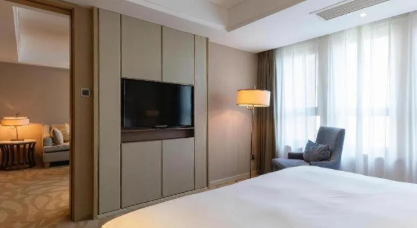 Bed in Sky World Hotel Qingdao