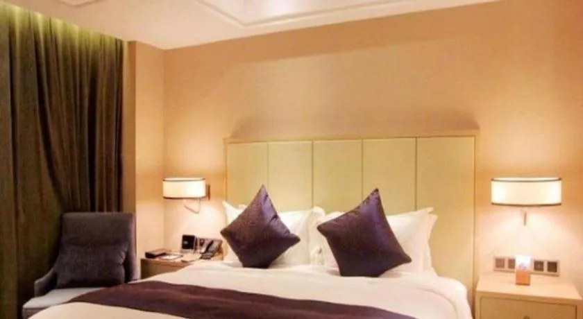 Bed in Sky World Hotel Qingdao