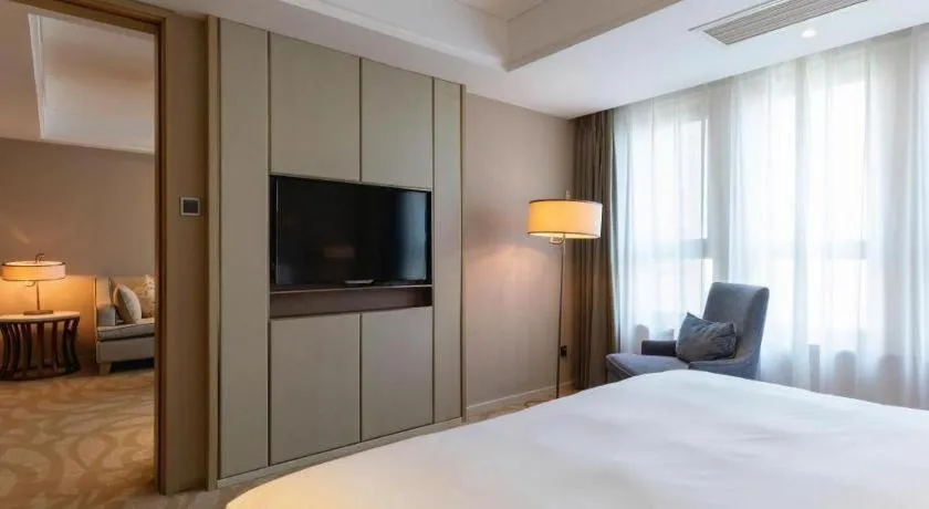 Bed in Sky World Hotel Qingdao