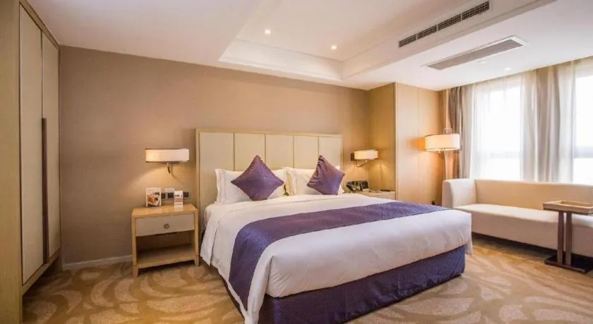 Bed in Sky World Hotel Qingdao