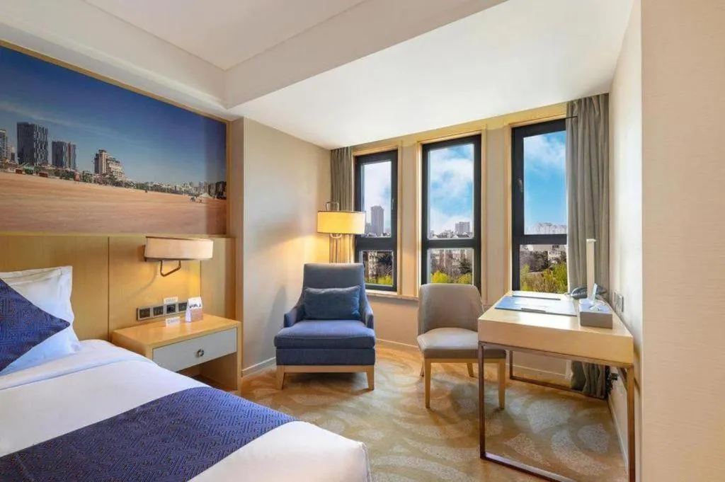 Bed in Sky World Hotel Qingdao