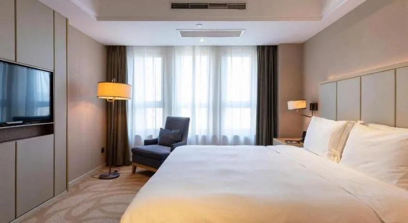 Bed in Sky World Hotel Qingdao