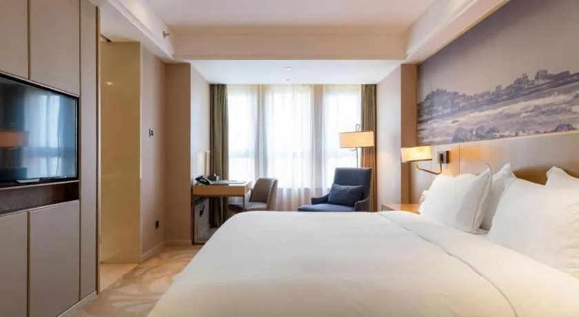 Bed in Sky World Hotel Qingdao