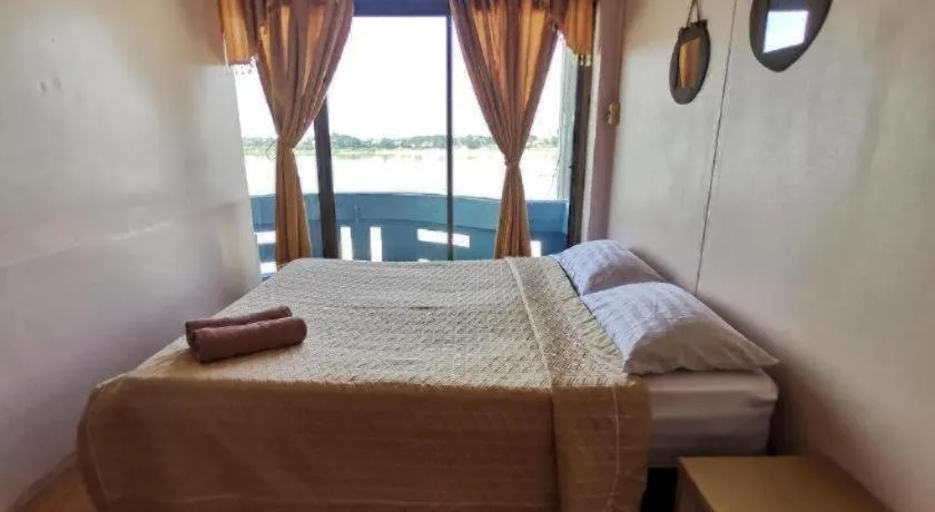 Bed in Just Mansion Hotel