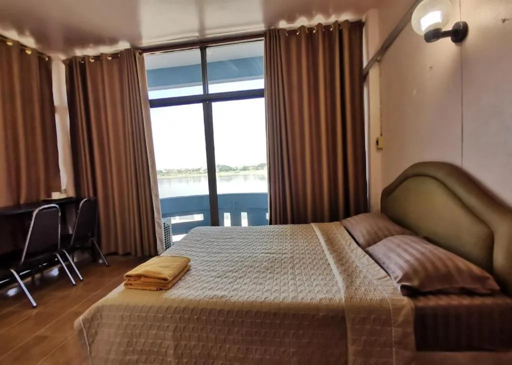 Bed in Just Mansion Hotel