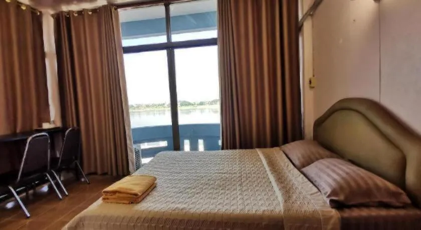 Bed in Just Mansion Hotel