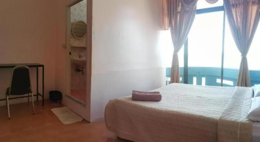 Bed in Just Mansion Hotel