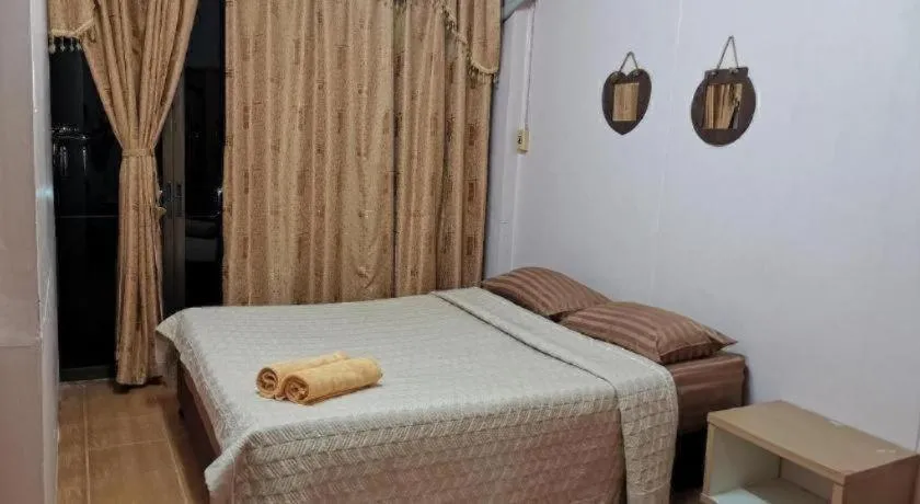 Bed in Just Mansion Hotel