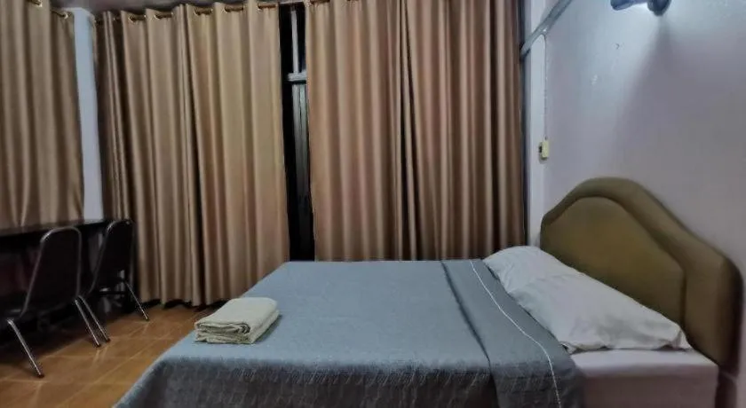 Bed in Just Mansion Hotel