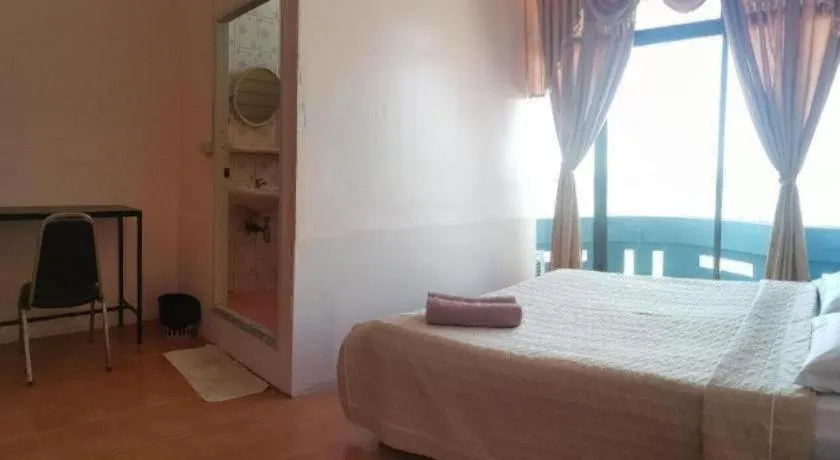 Bed in Just Mansion Hotel