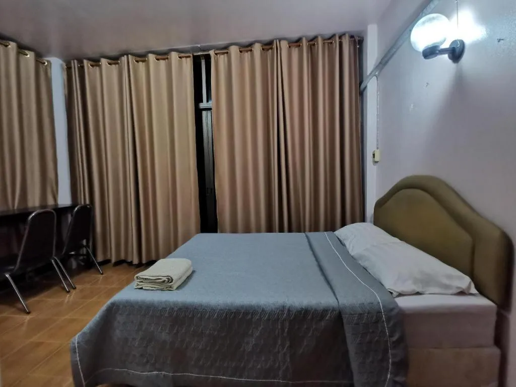 Bed in Just Mansion Hotel