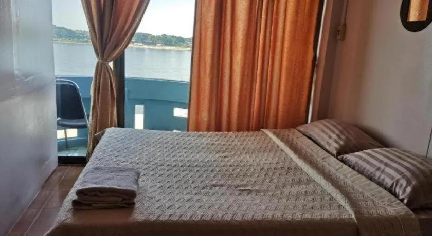 Bed in Just Mansion Hotel