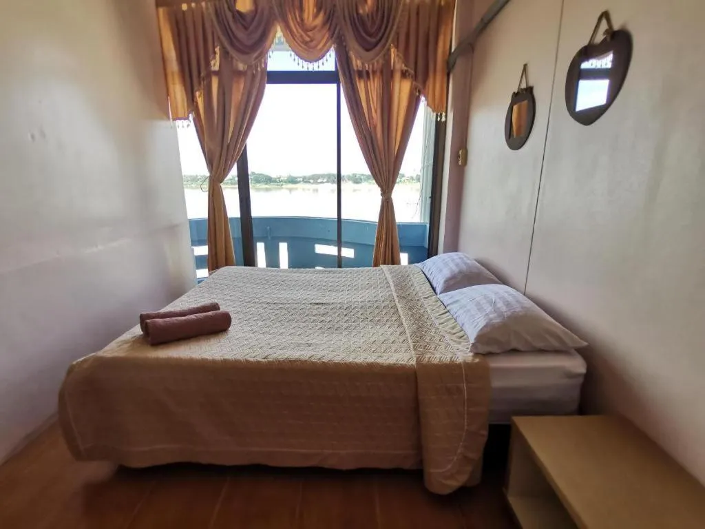 Bed in Just Mansion Hotel