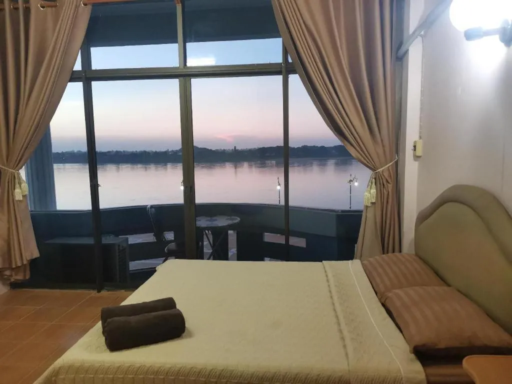 Bed in Just Mansion Hotel