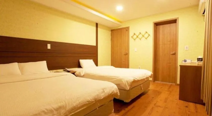 Bed in CJ Tourist Hotel