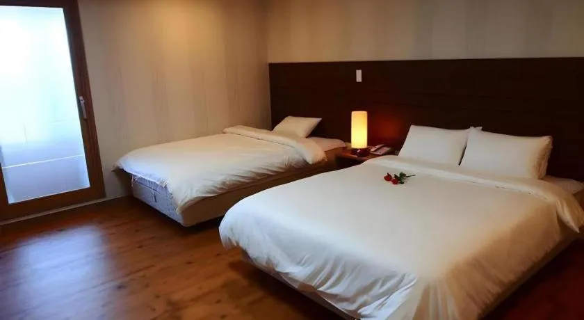 Bed in CJ Tourist Hotel