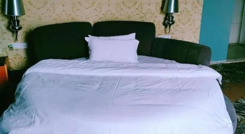 Bed in Foshan Nanhai Huifeng Holiday Hotel