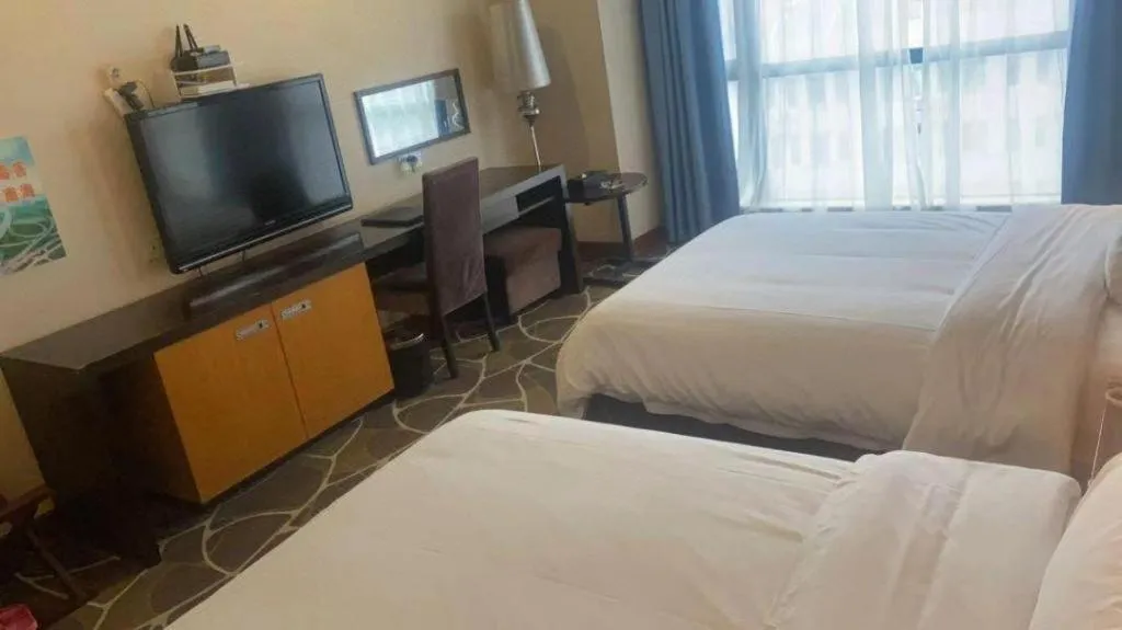 Bed in Foshan Nanhai Huifeng Holiday Hotel